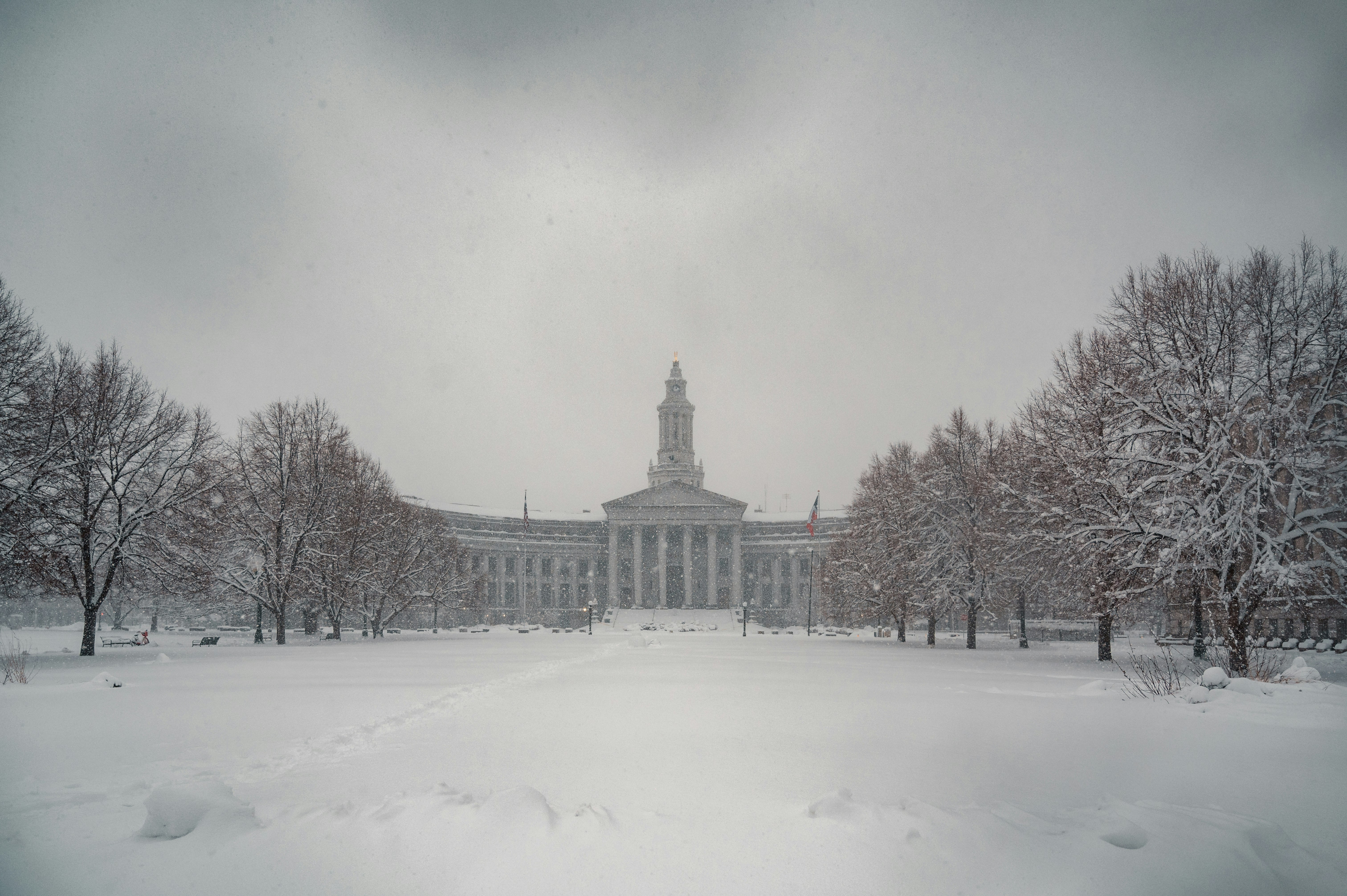 white building surrounded by snow covered ground